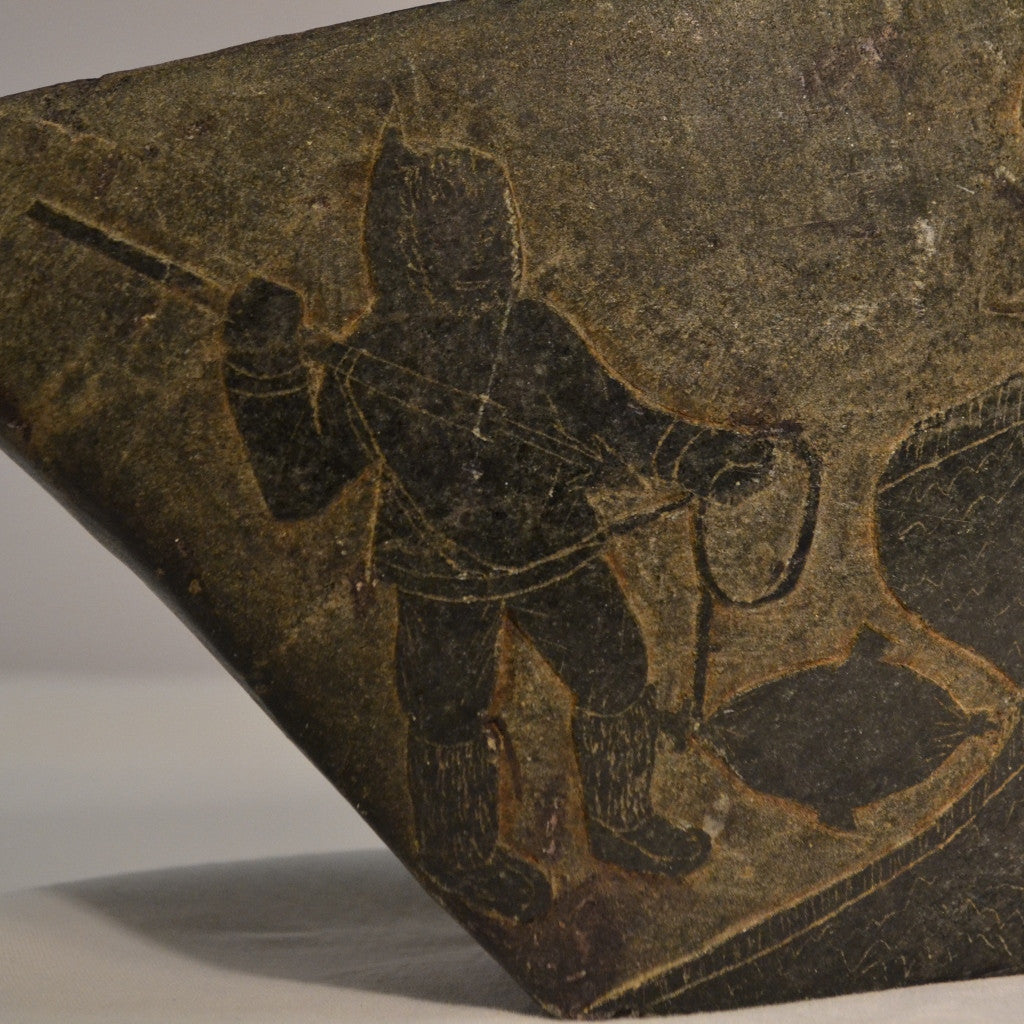 Inuit stone relief hunting scenes