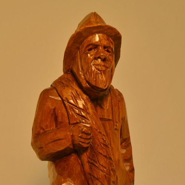 Fisherman with lobster trap wood carving