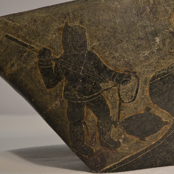 Inuit stone relief hunting scenes