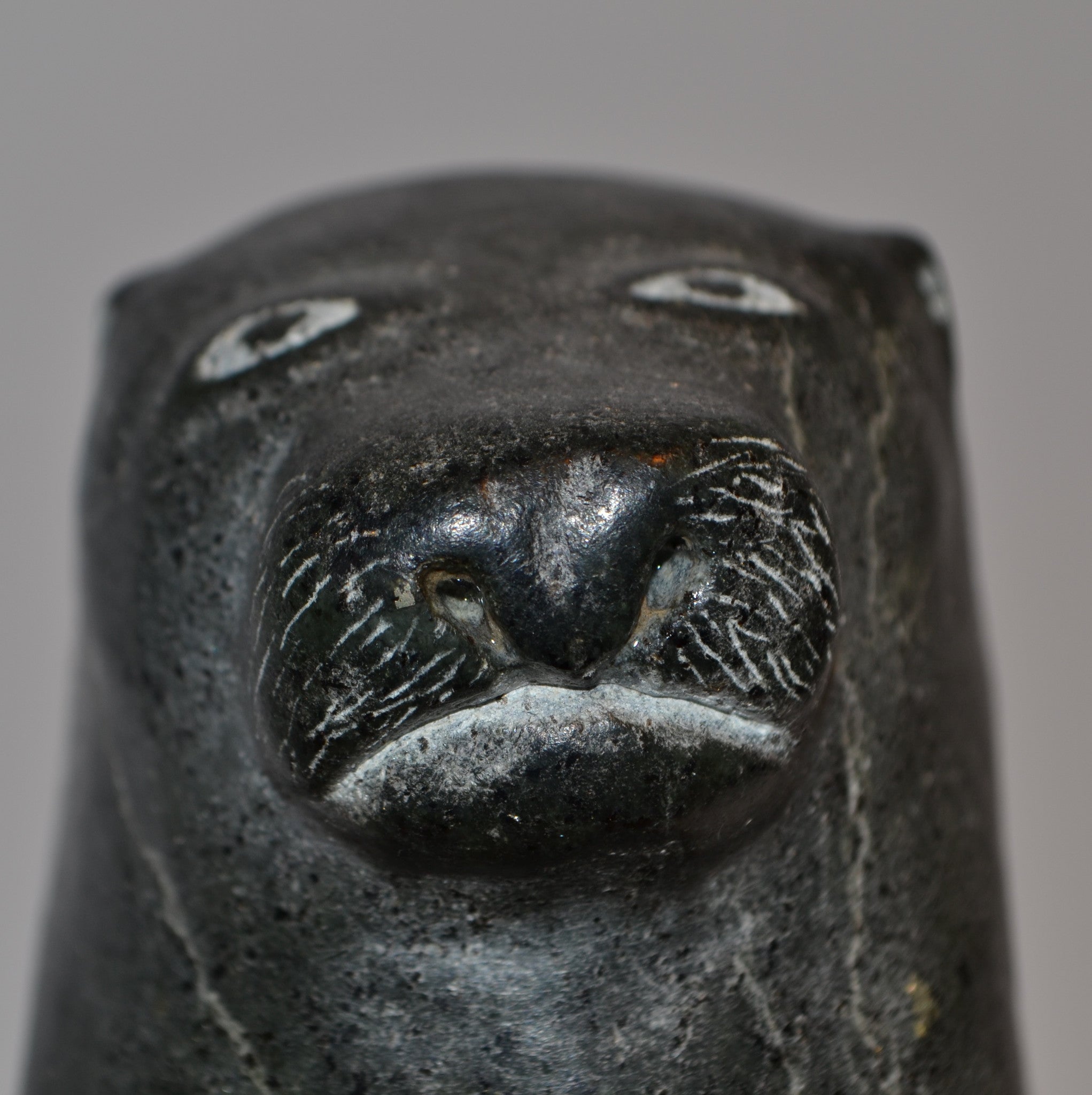 Inuit carving sea otter face