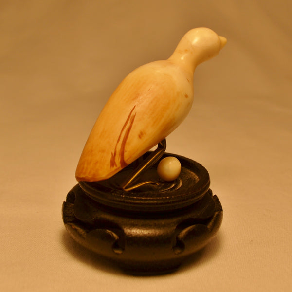Miniature Inuit ivory water bird carving with egg