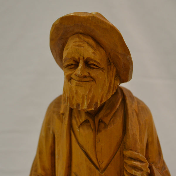 Old smiling man wood carving by Pelletier