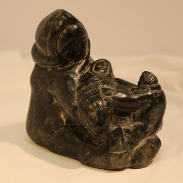Woman with baby and child inuit carving