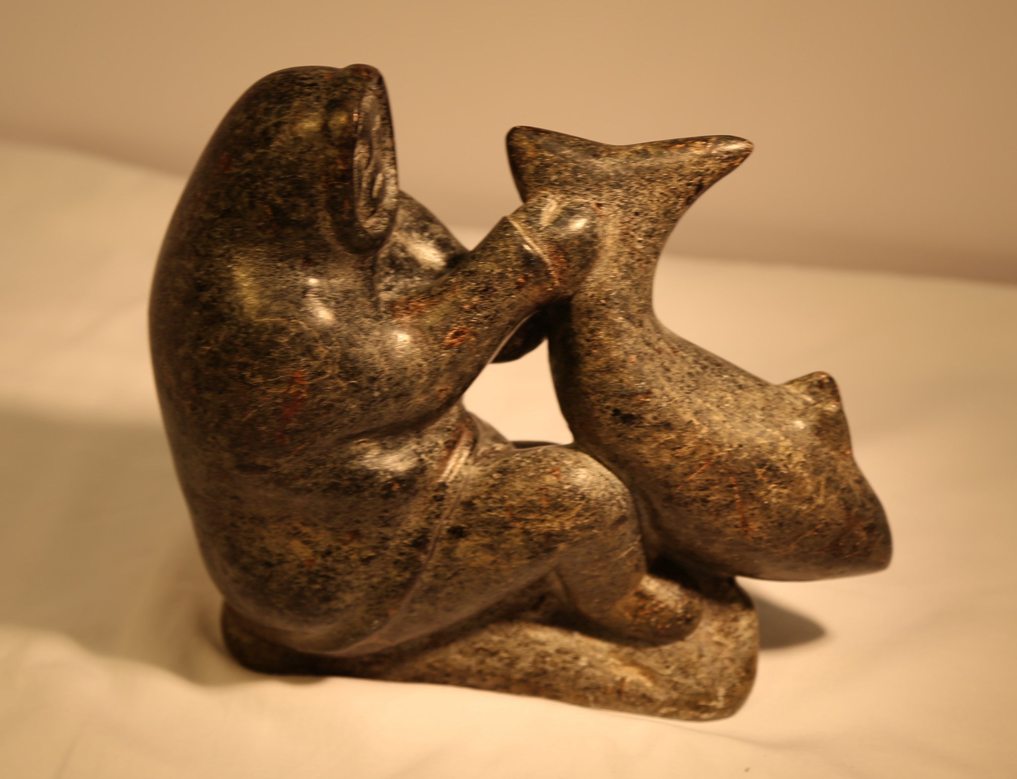 Inuk Holding Large Fish Inuit Carving | Langford Gallery
