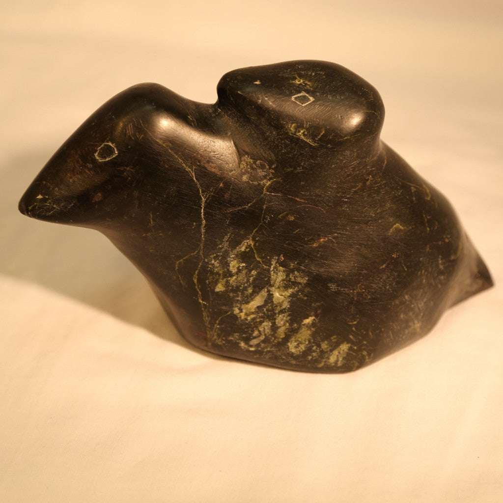 Primitive bird with chick stone carving