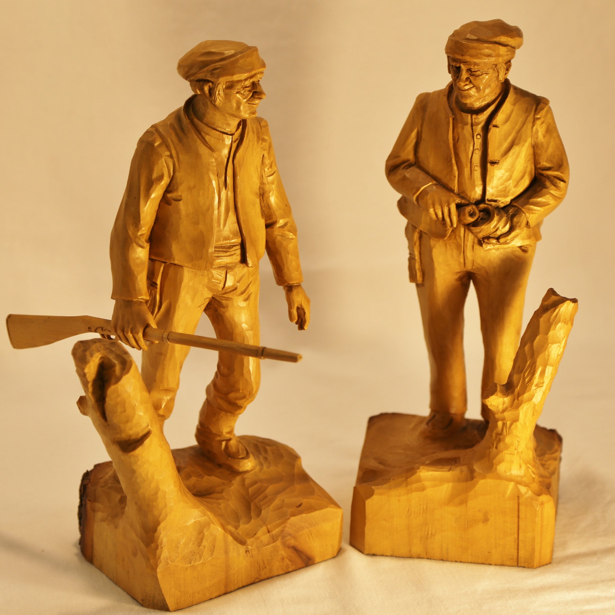 Two hunter carvings by Roger Bourgault