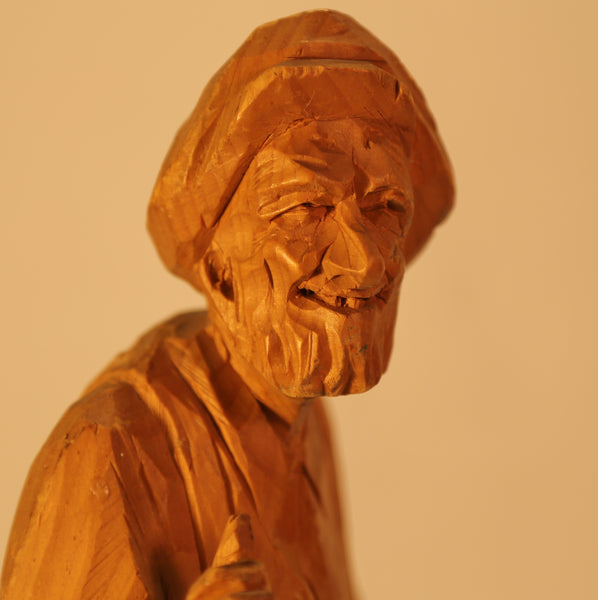 Man wood carving by P.E. Caron